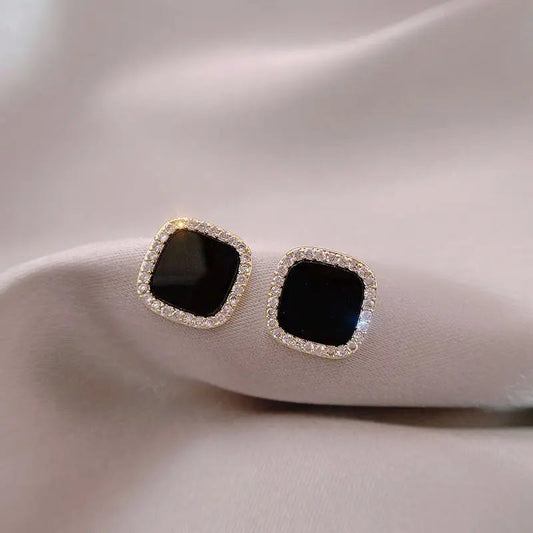 Tidless onyx øreringe med diamanter