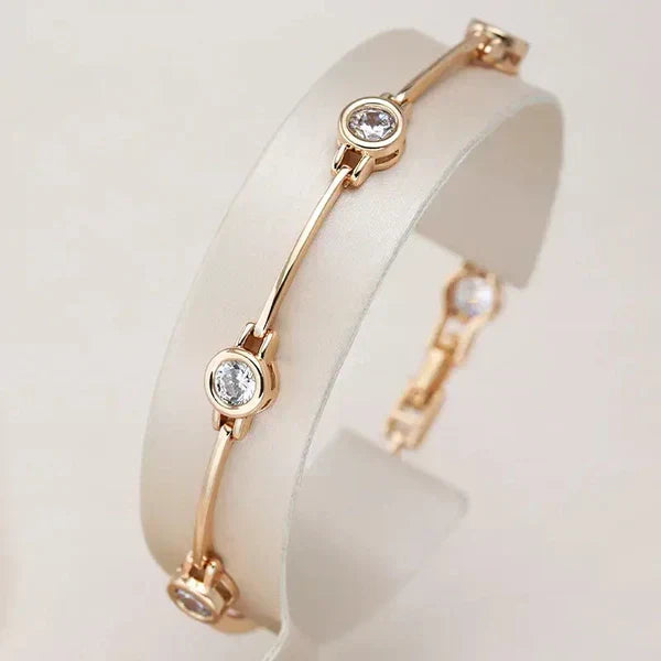 1+1 Tilbud: Elegant Guld- og Krystaløreringe + Elegant armbånd med zirconia i guld