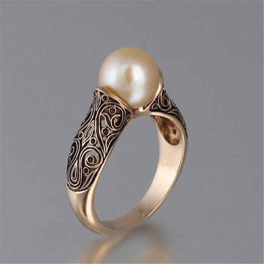 Vintage guldring med en fancy perle