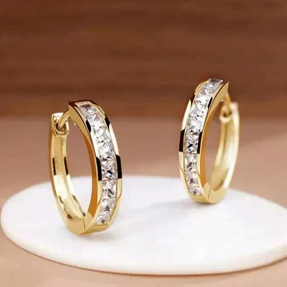 1+1 Tilbud: Elegant Guld- og Krystaløreringe + Elegant armbånd med zirconia i guld